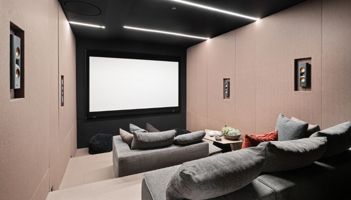 A dedicated home theater with on-wall speakers
