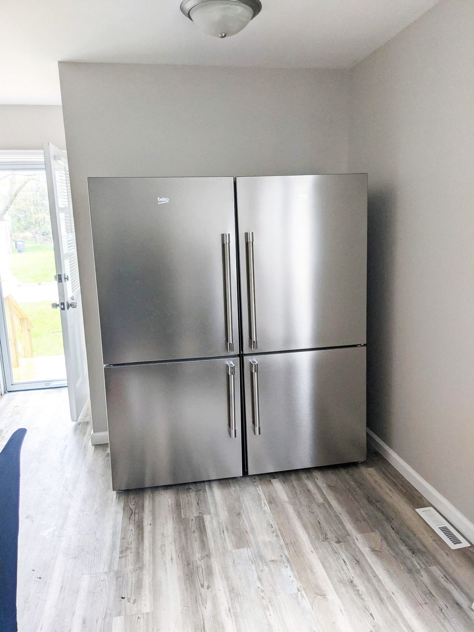 Wide shot of two Beko bottom freezer refrigerators side by side