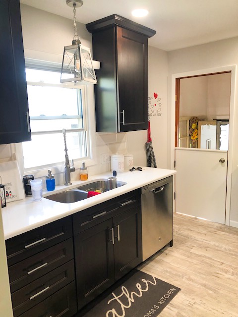 Renovated dishwasher and sink by designer Mick Evans