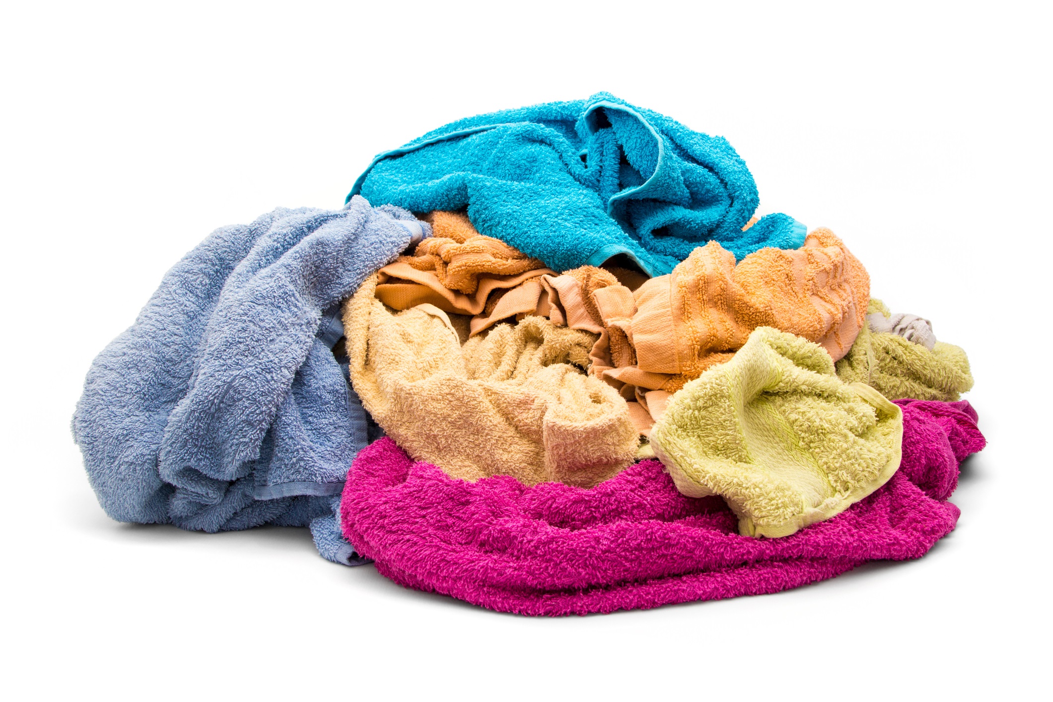 Wet towels in various colors in a pile 