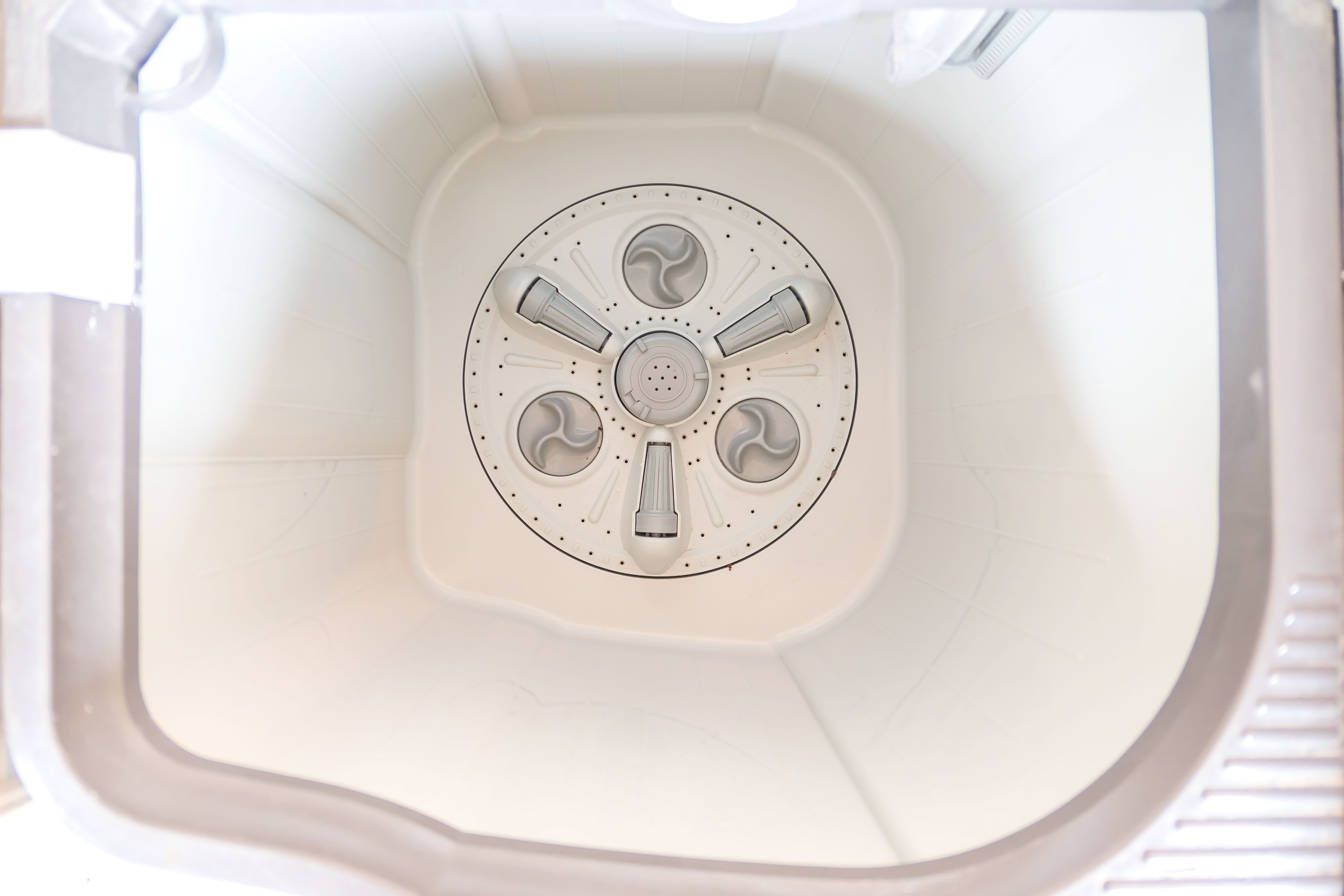 aerial shot of impeller inside top loading washing machine