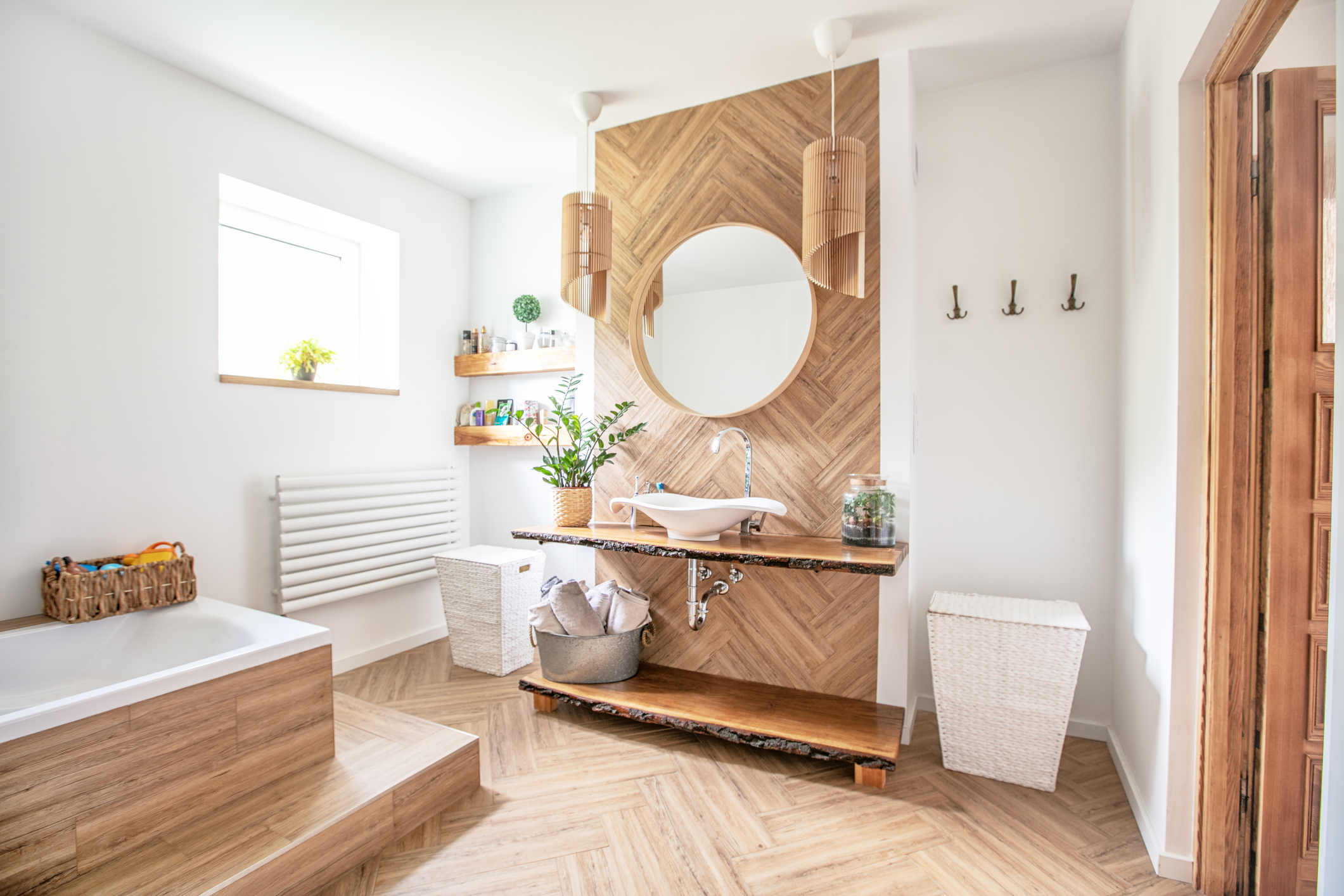 Boho bathroom with wood flooring