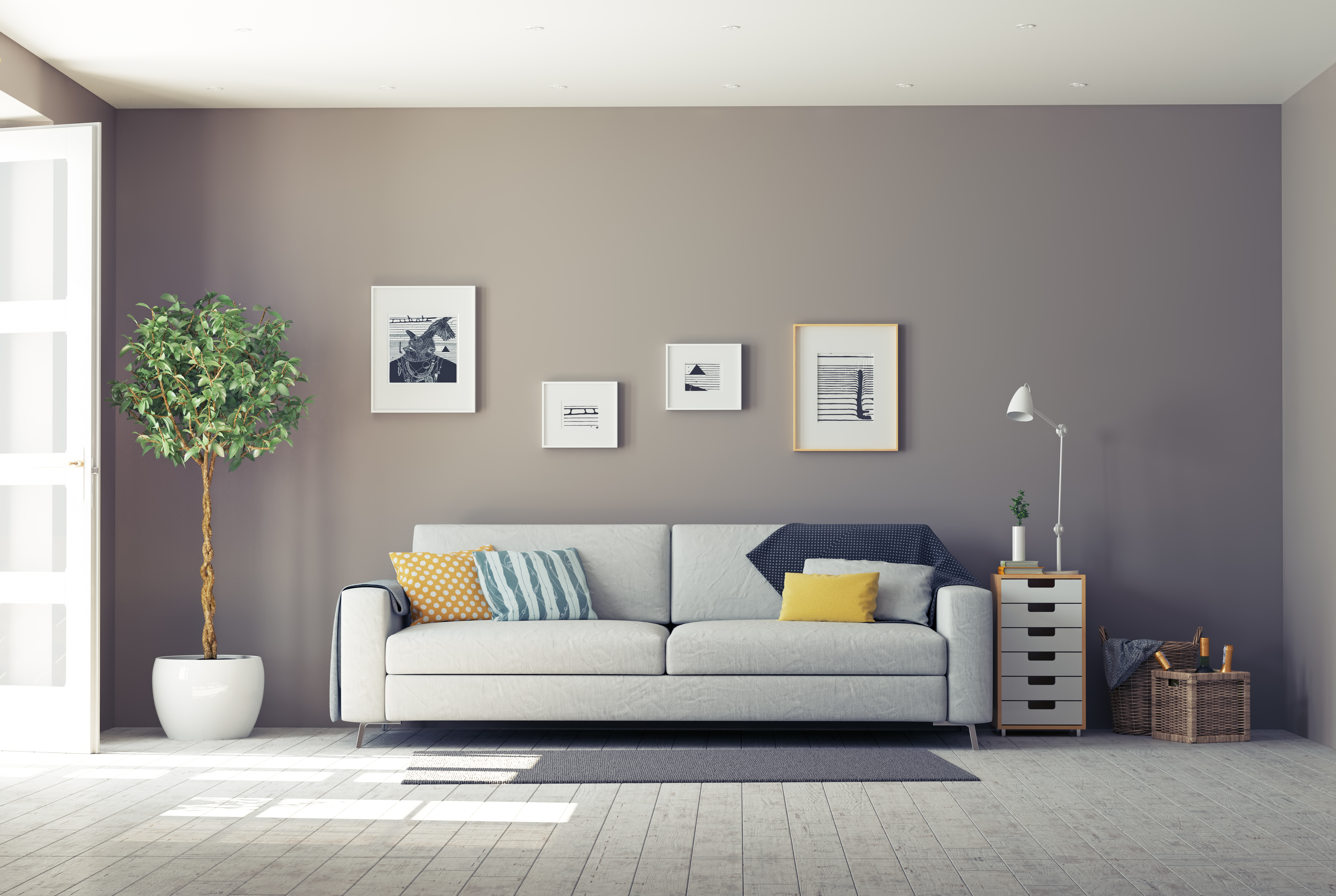 Wide shot of a grey sofa with colorful throw pillows