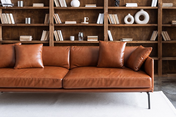 Brown leather sofa in a modern office. 