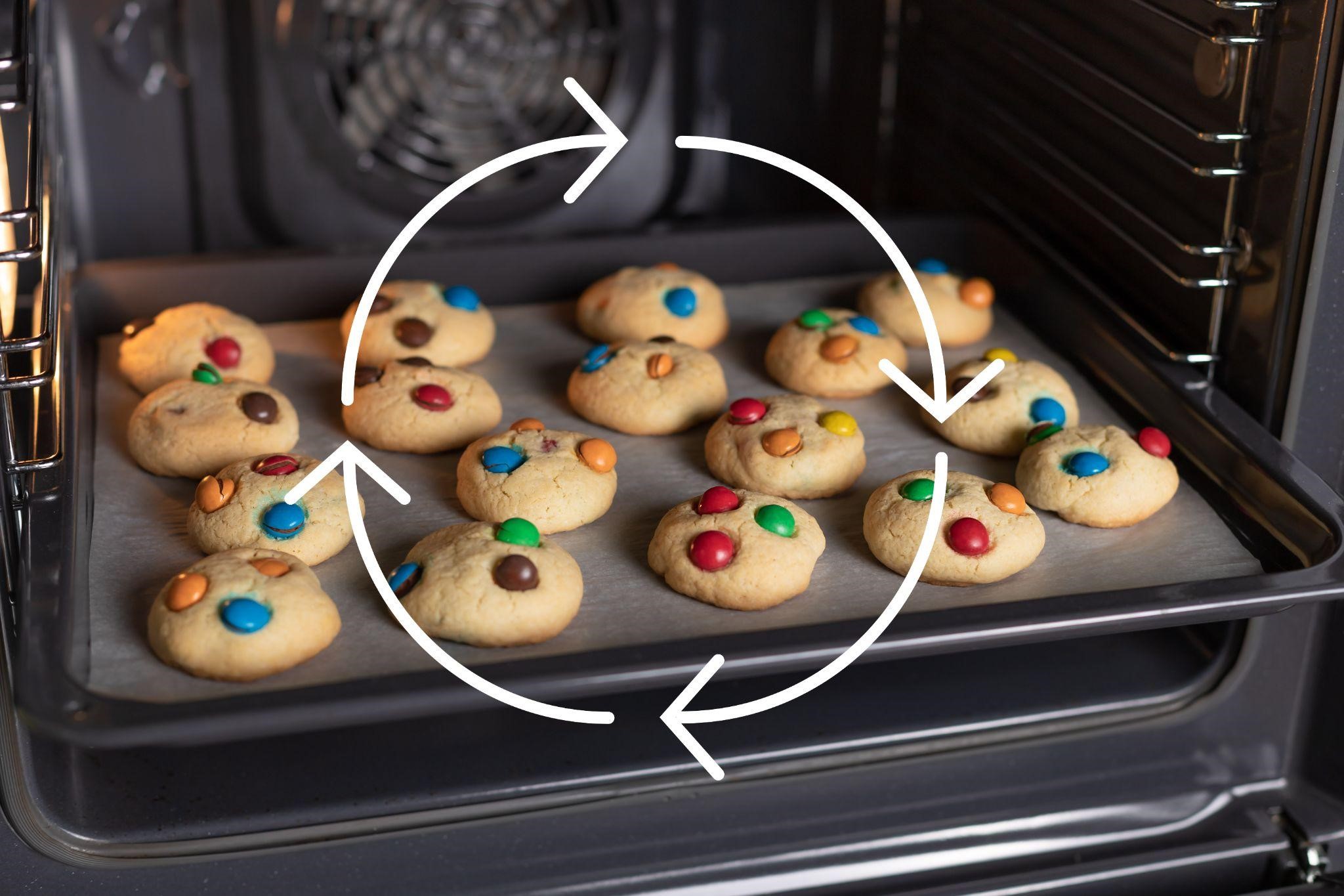 Cookies baking in an oven with graphic overlay showing air current flow