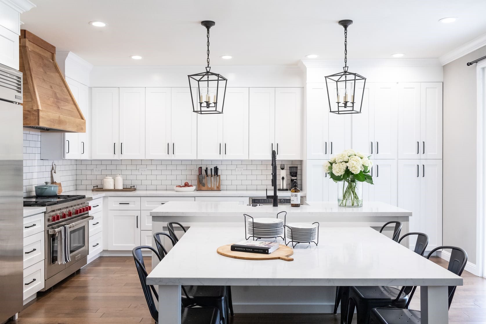View of farmhouse-style kitchen with industrial elements 