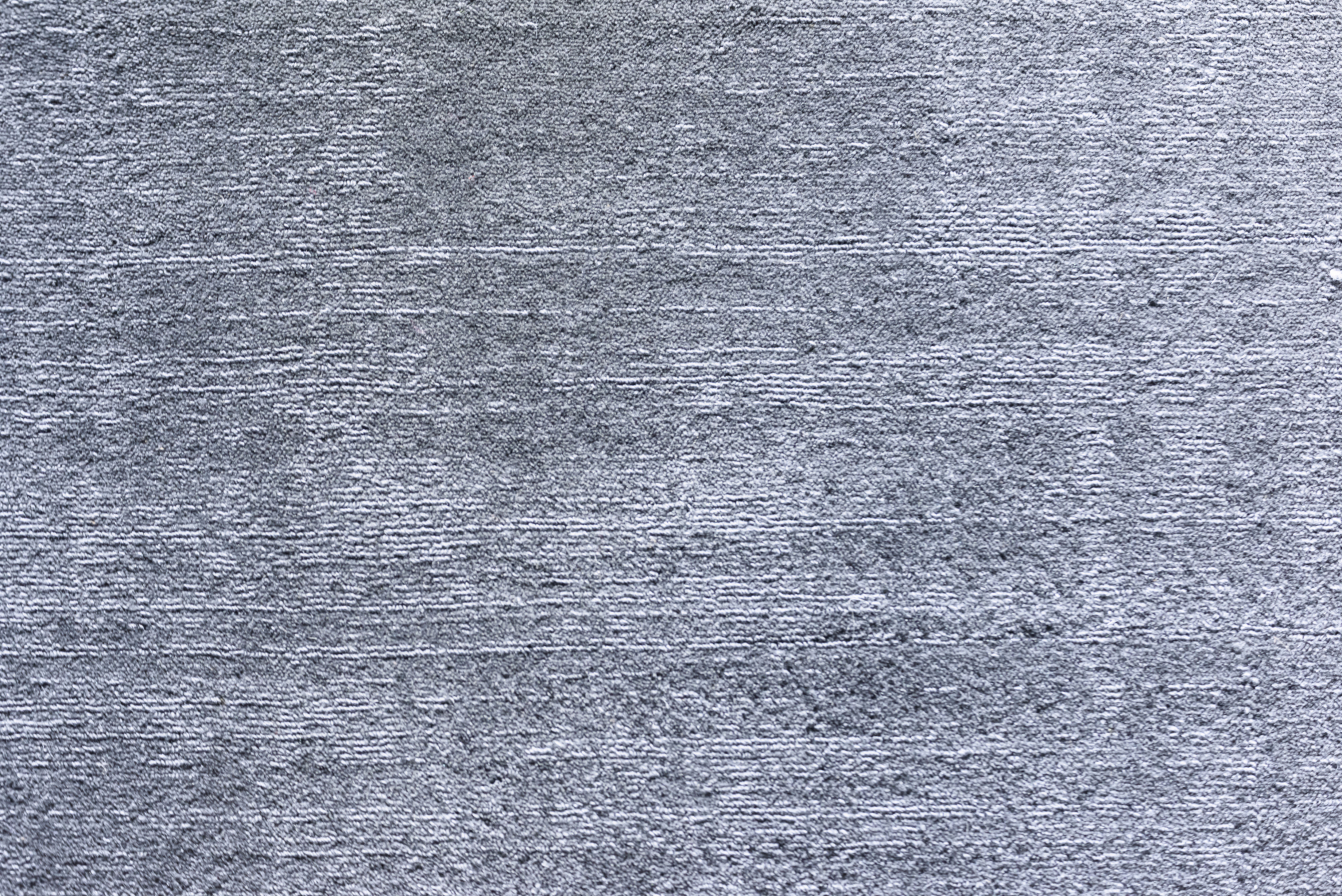Up close look at low pile carpeting in gray tone
