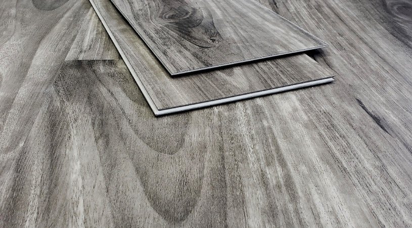 Laminate wood flooring shown installed and loose