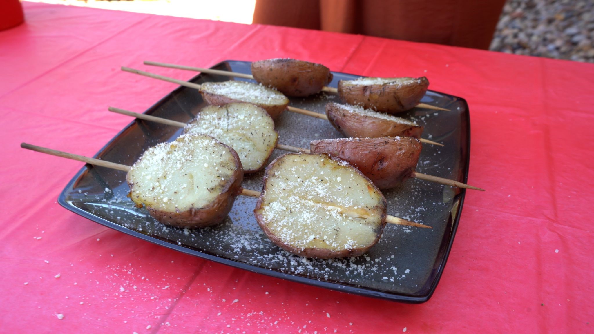 Grilled red potatoes on wooden skewers