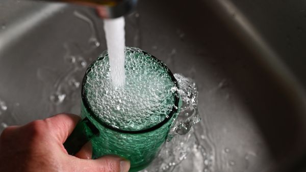 Glass Overfilled In Sink