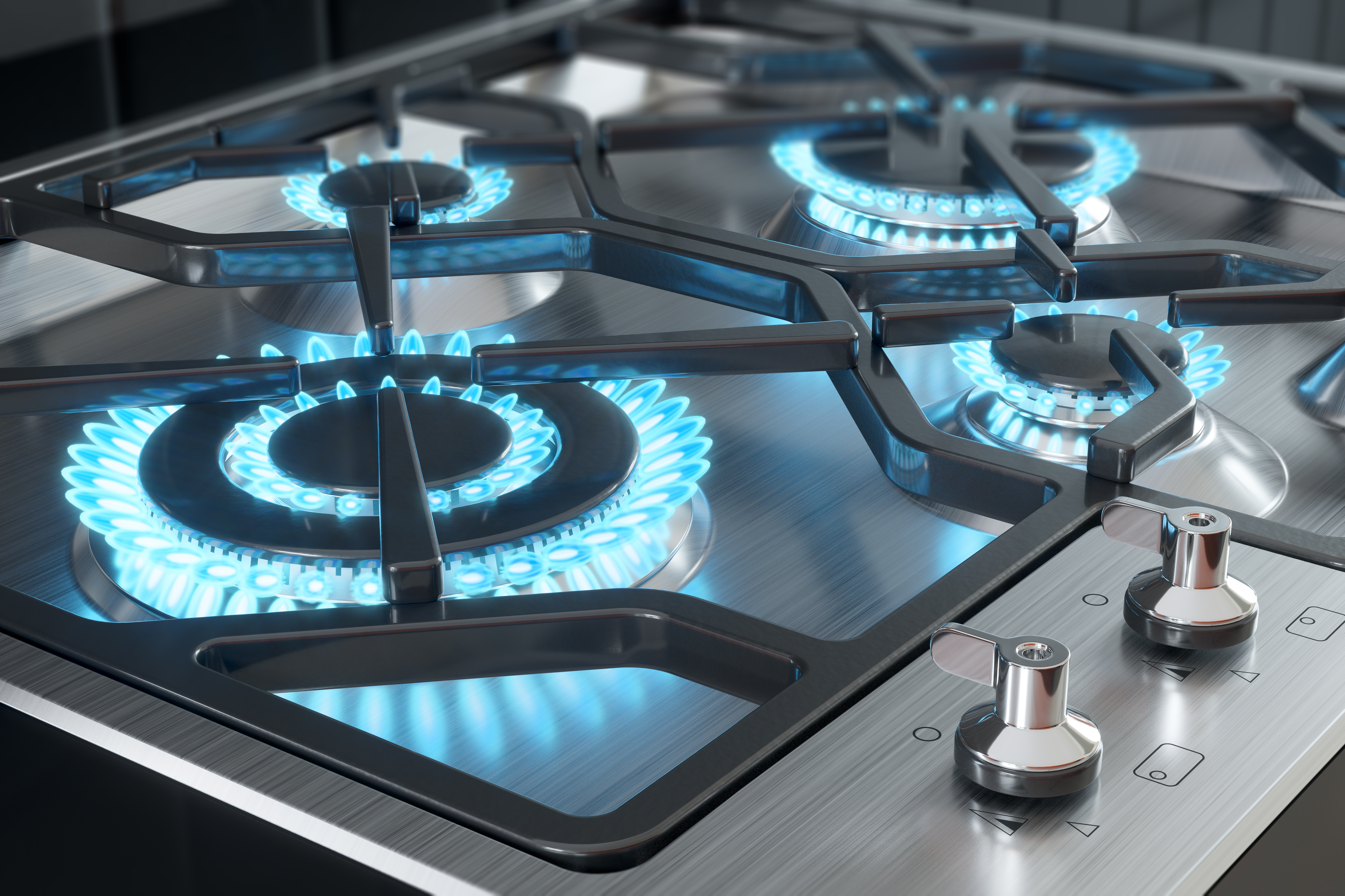 Overhead view of a gas cooktop with burners on