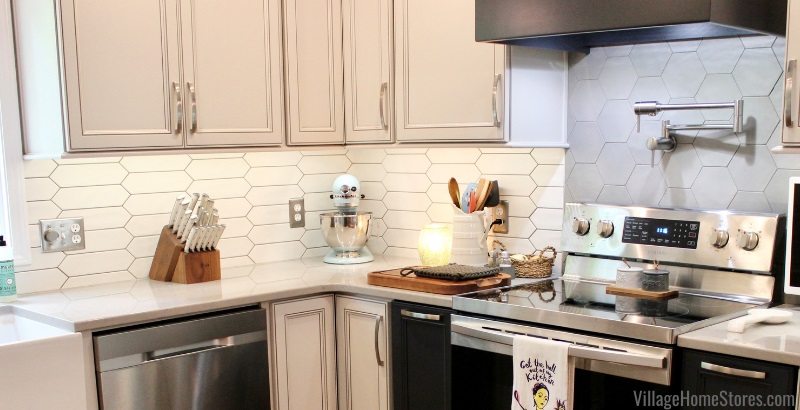 kitchen backsplash installed with matte white crayon shaped tiles and gray hex tiles for accent above stove