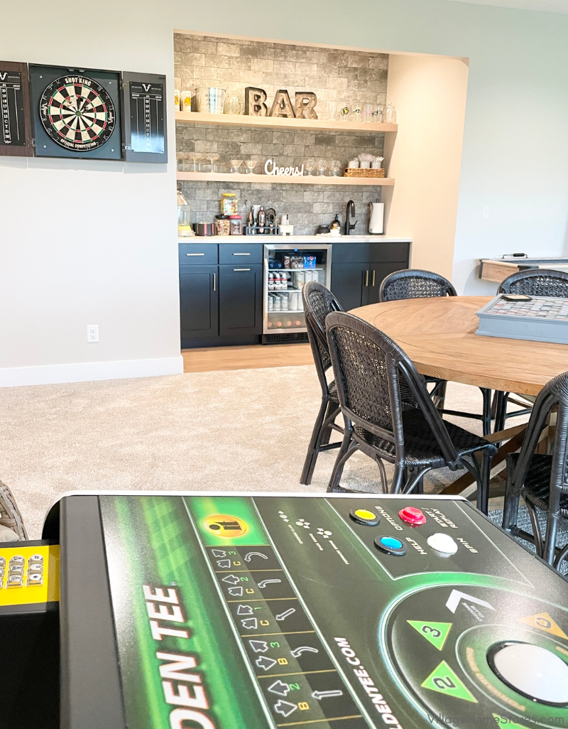 image of gold golden tee game with wet bar in background