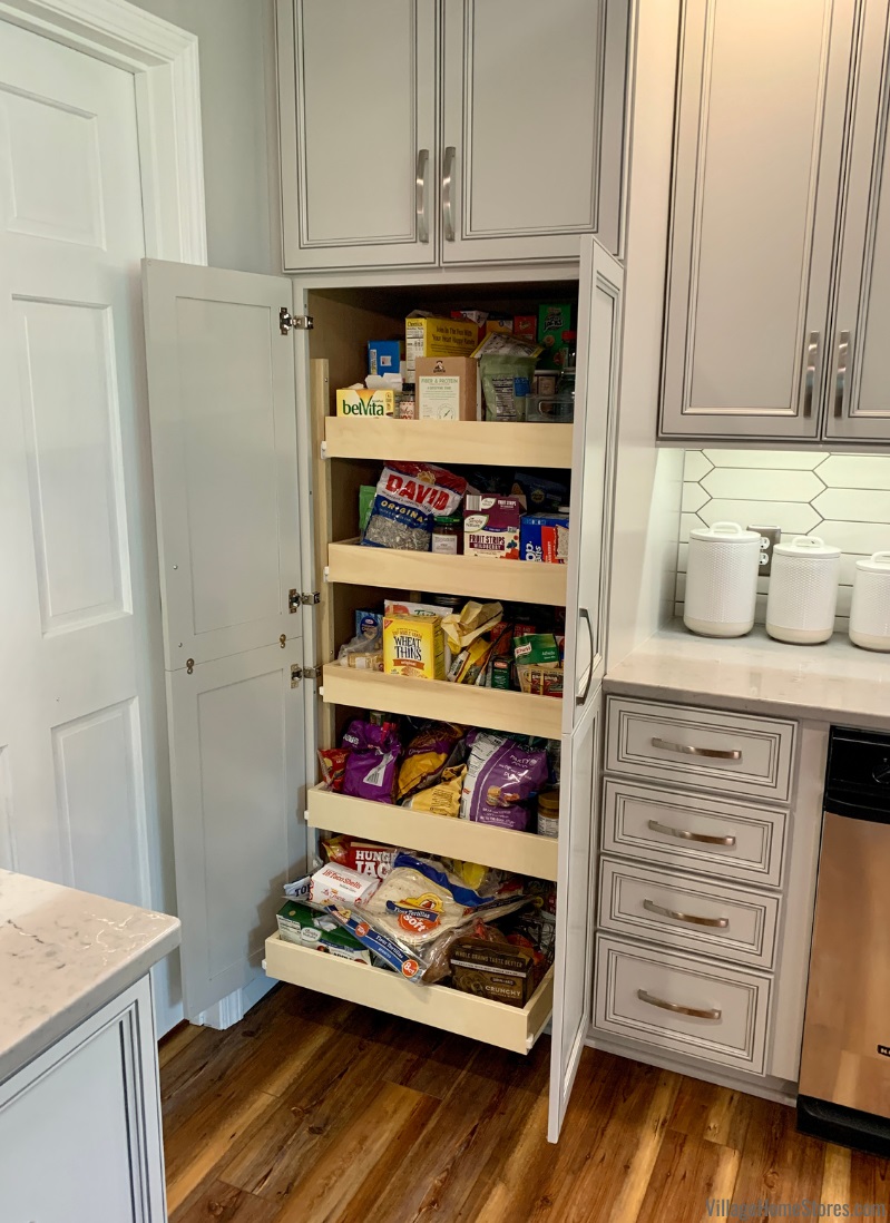 Tall pantry cabinet with doors open and slide out shelves shown.
