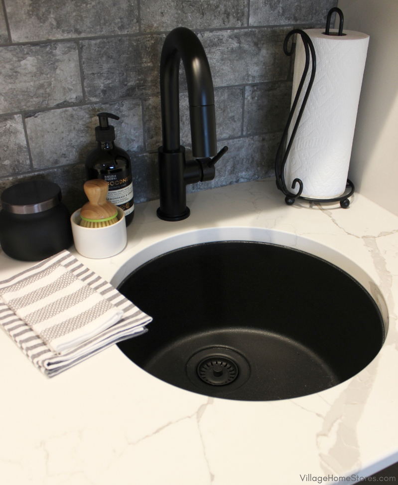 Matte black round bar sink in a game room wet bar. Installed into Calacatta Laza quartz counters in a Bettendorf Iowa home. 