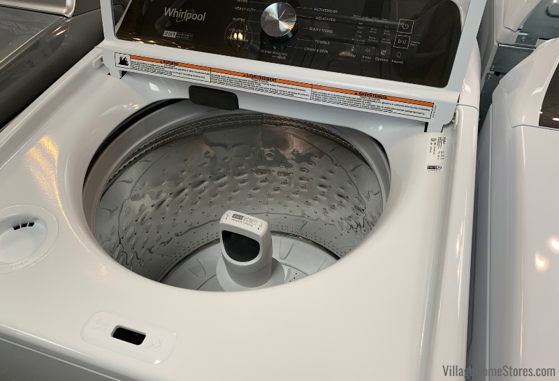 washing machine interior with agitator in place and with it removed