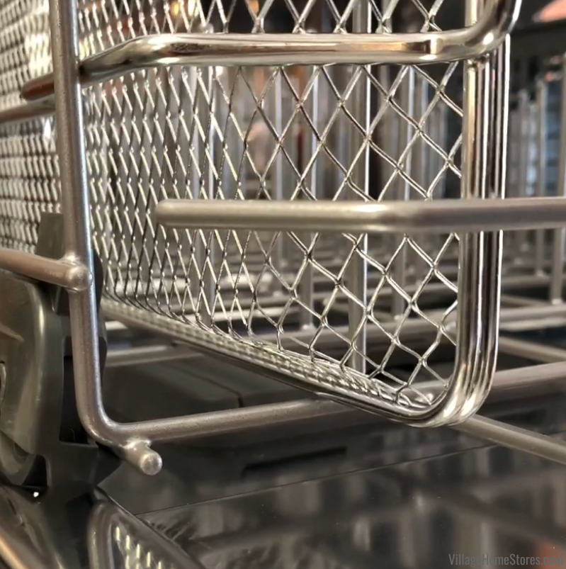 close shot of dishwasher safe air fry basket loaded into dishwasher