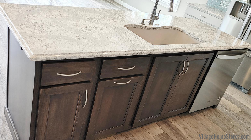 Kitchen island with sink and Cambria Summerhill quartz tops. Beech wood cabinetry in a warm gray Stone stain