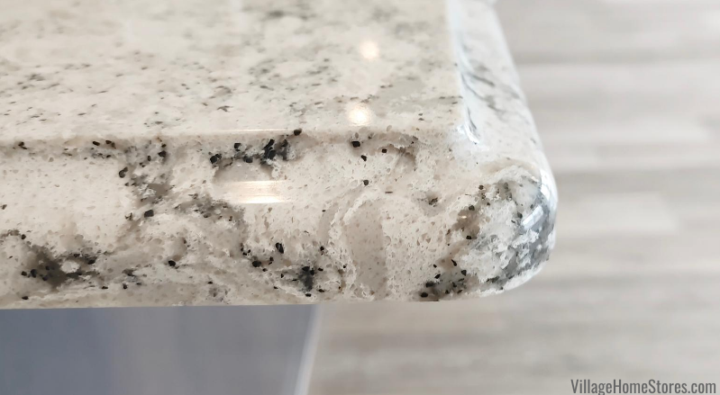 Close up corner shot of Cambria quartz countertops in kitchen Summerhill design and Ogee edge profile