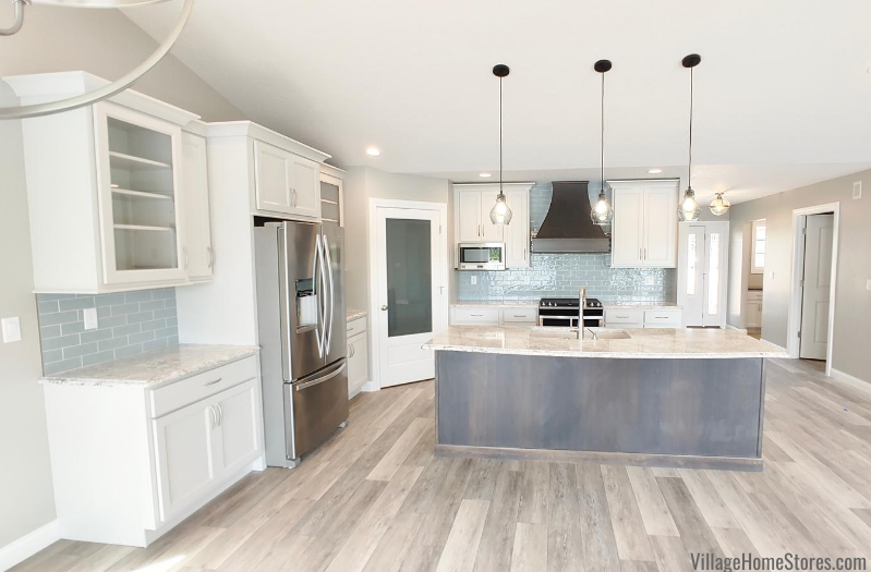 Kitchen with Oyster white painted cabinets and gray stained kitchen island at center