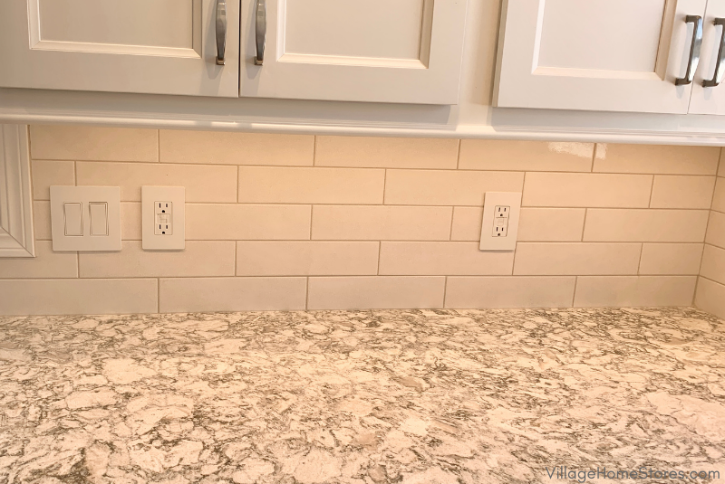 Crackle white tile backsplash installed on cambria quartz counters