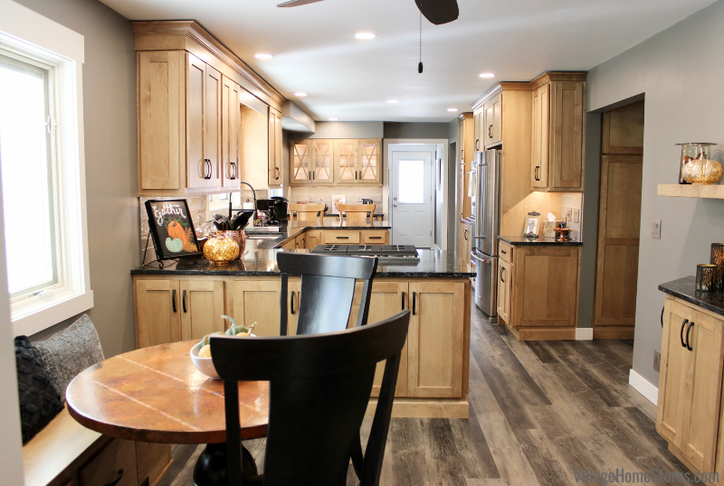 Image of kitchen with two peninsulas and bench seat banquette area