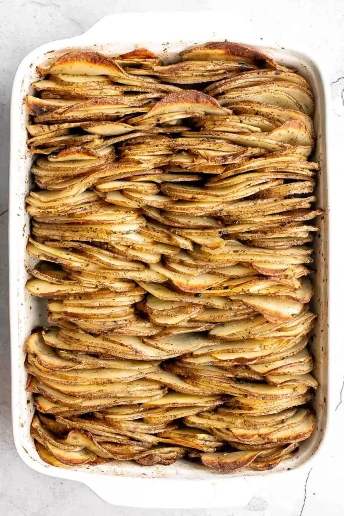 Overhead shot of casserole full of roasted gratin-style potatoes