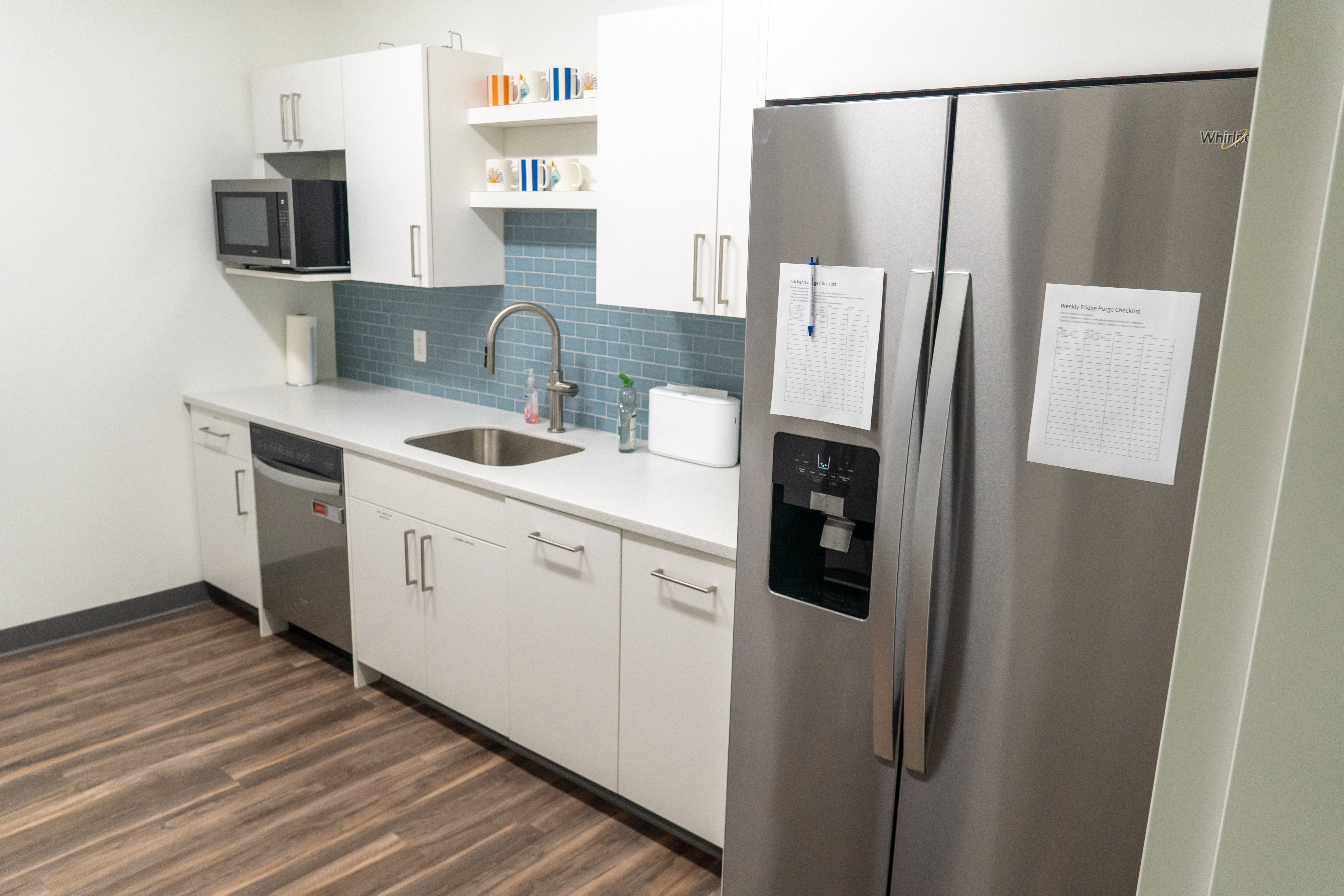 Wide shot of Community Action House kitchen with Whirlpool apppliances