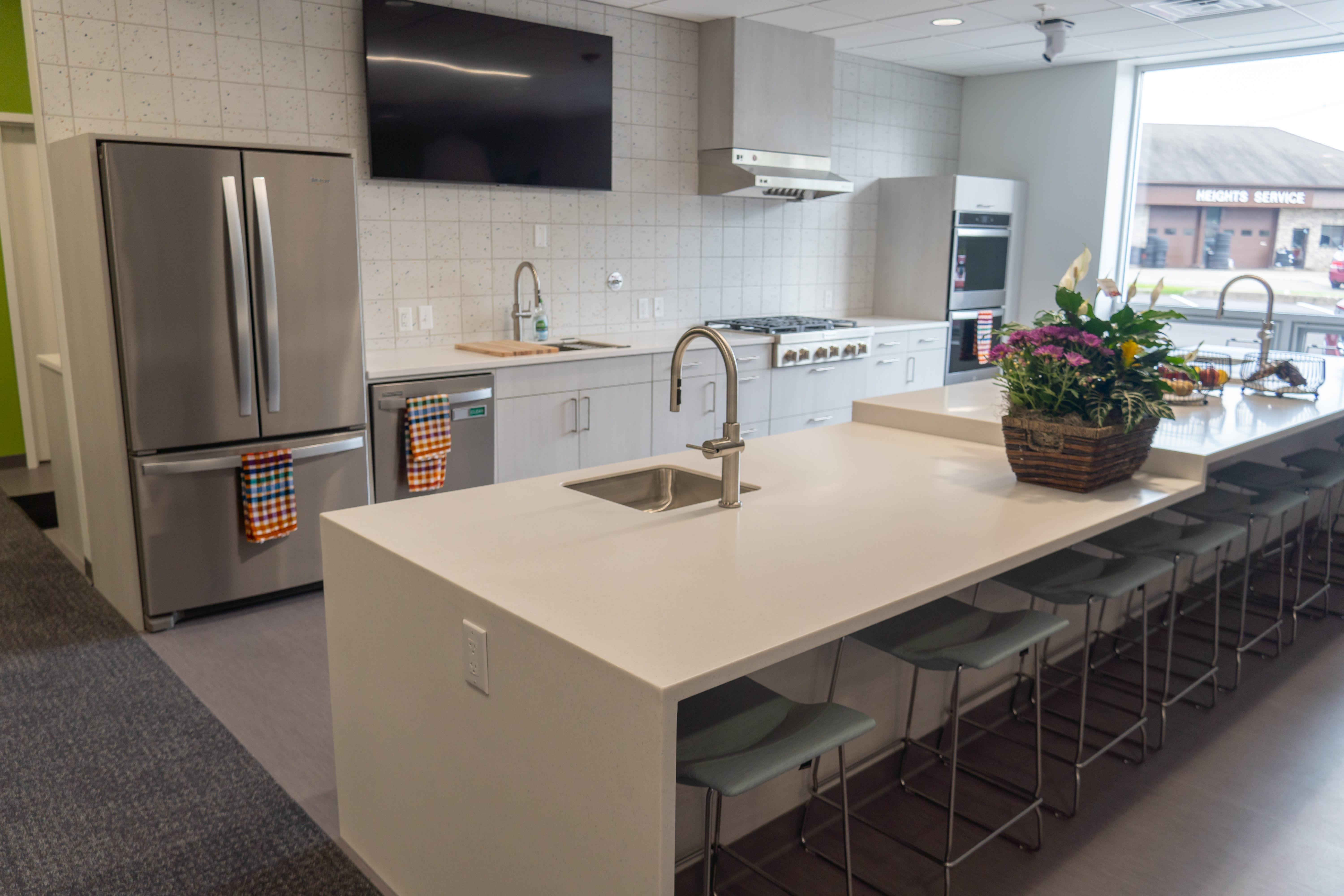 Community Action House kitchen featuring Whirlpool appliancesd