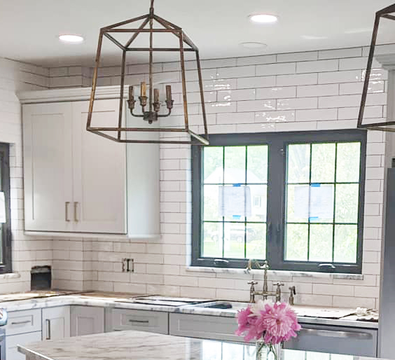Bright modern kitchen with stone countertop.