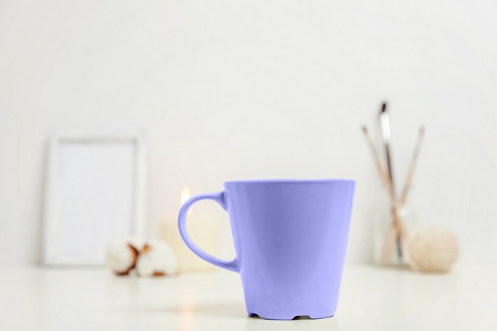 Close up of a periwinkle coffee mug. 