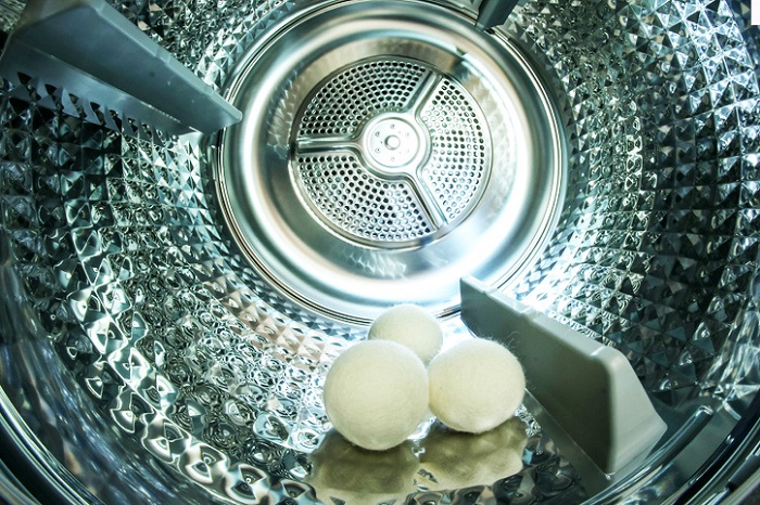 Dryer balls sitting in empty dryer.