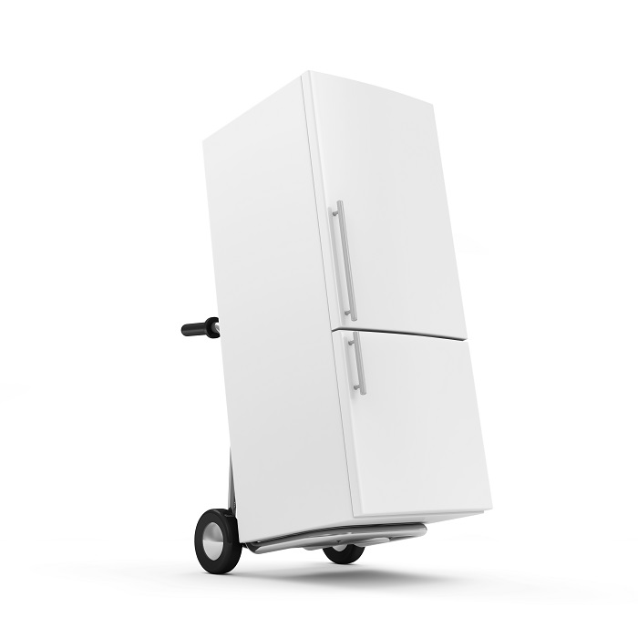 Stock photo of a fridge sitting on a dolly.