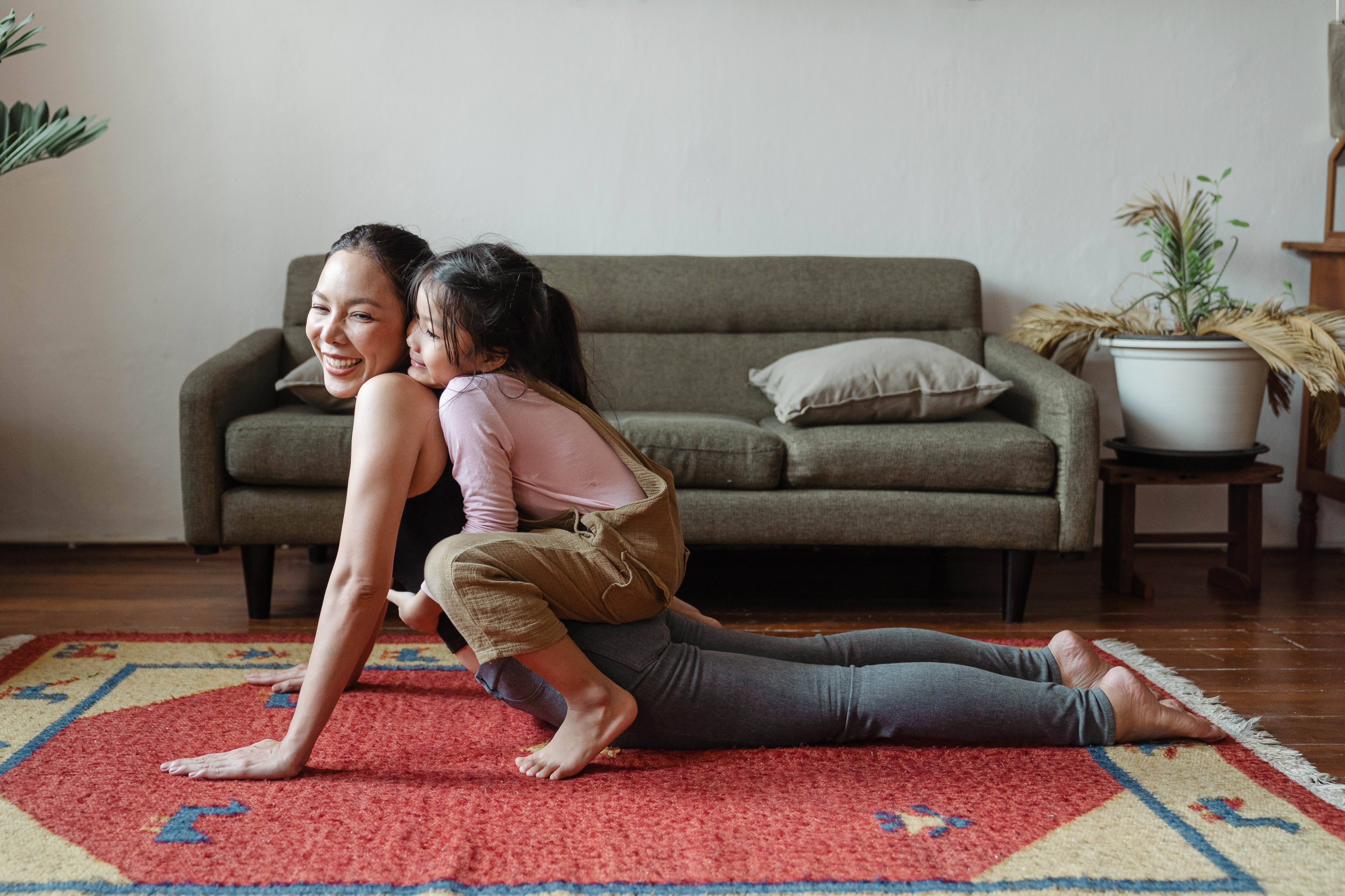 mother and daughter doing yoga