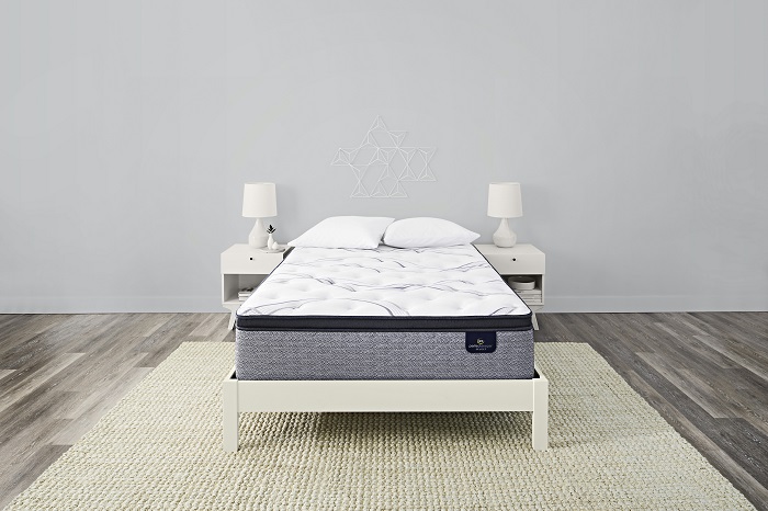 Brand new mattress in a modern stock bedroom.