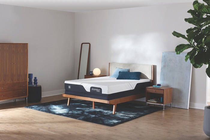 New mattress in a naturally lit bedroom.