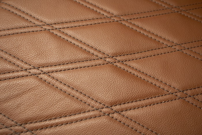 Close up of woven brown leather.