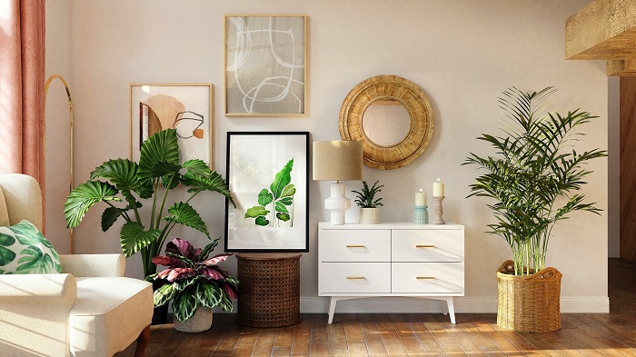 Modern living room with several houseplants and artwork.