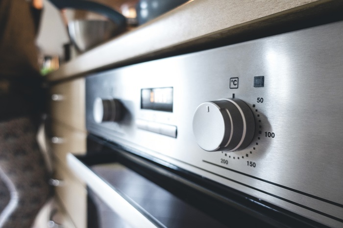 View of a stainless steel oven temperature gage.