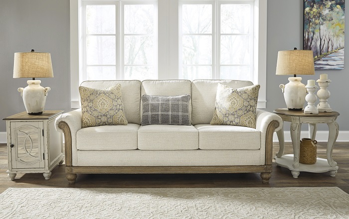 Modern sofa sitting in a brightly lit living room.