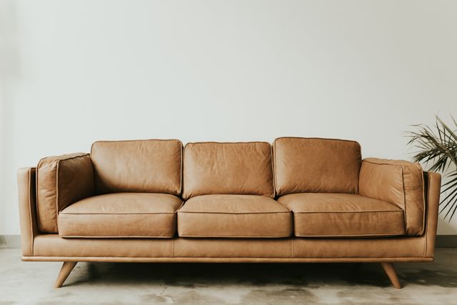 front view of a brown leather sofa