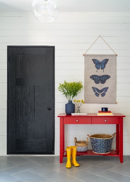 Long shot of Canadel hallway drawer set in red finish