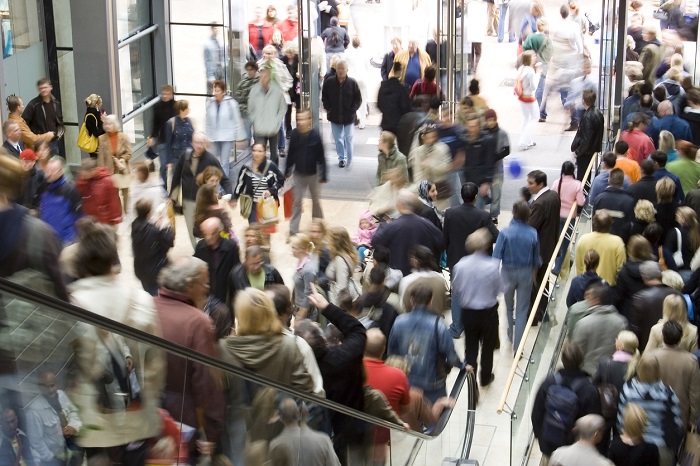Huge crowd shopping in a mall. 