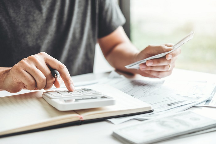Man using calculator. 
