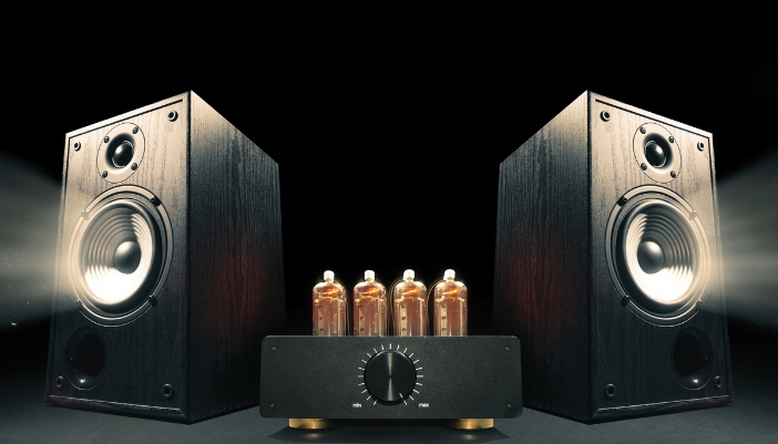 A small tube amp hooked up to two big speakers