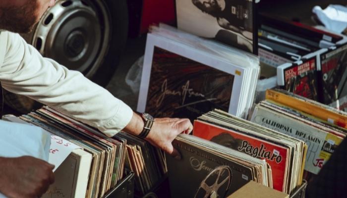 Hand reaching for vinyl albums