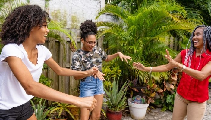 young women dancing outside