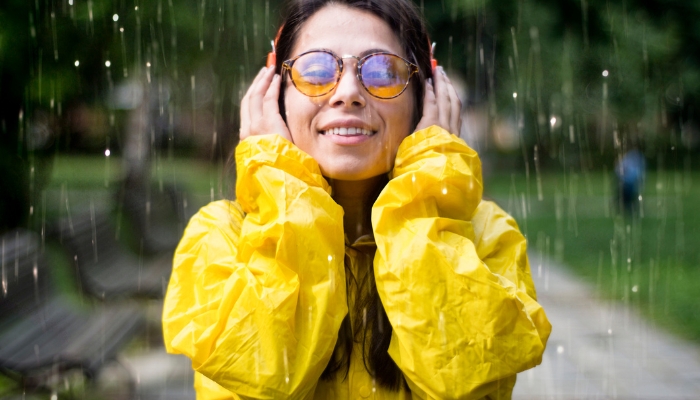 Woman listening to music in the rain