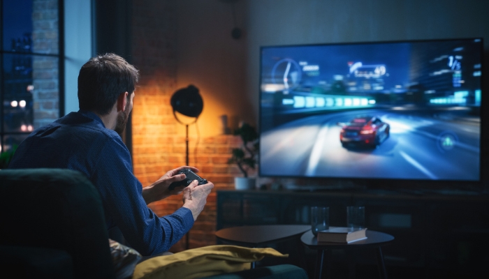Man gaming on a nice TV