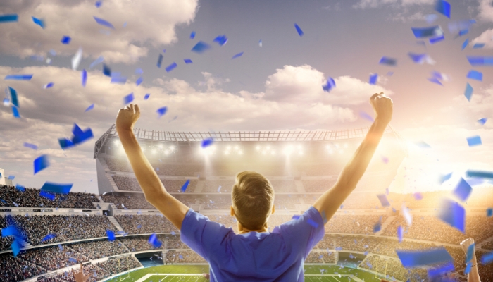 Man cheering at Super Bowl game
